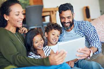 Image showing Digital tablet, relax and happy family on a sofa with streaming, subscription and games app in their home. online, entertainment and children with parents in living room for internet fun and bonding