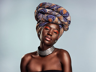 Image showing Black woman in African turban, portrait with fashion and beauty, makeup isolated on studio background. Natural cosmetics, glow and female model with traditional head wrap, mockup space and style