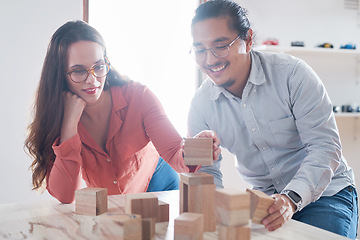 Image showing Teamwork, man and woman with building blocks in startup office for challenge game and design innovation with vision. Engineering, architecture and designer team with block games for problem solving