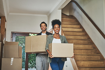 Image showing Happy couple, real estate and moving in new home with boxes for renovation, investment or relocation. Interracial man and woman owner carrying box for property rent, mortgage loan or move together