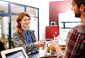 Image showing Woman smile, customer and credit card at a coffee shop for payment with a order at restaurant. Female person, happiness and diner to pay and buy at cafe with male store assistant and barista