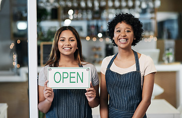 Image showing Happy woman, open sign and portrait of cafe team in small business or waitress for morning or ready to serve. Women or restaurant servers holding board for coffee shop, store or cafeteria opening