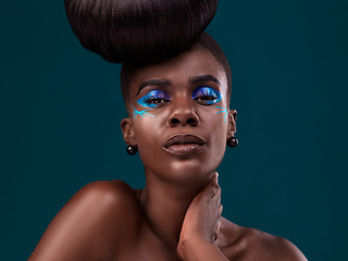 Image showing Portrait, makeup and glamour with an african woman in studio on a blue background for hair care or cosmetics. Face, confidence and fashion with an attractive young female model at the salon for style