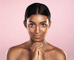 Image showing Face portrait, skincare and woman in studio isolated on a pink background. Natural beauty, aesthetic and Indian female model with makeup, cosmetics and spa facial treatment for healthy skin glow.