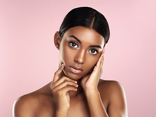 Image showing Serious face, skincare and woman in studio isolated on a pink background. Natural beauty, portrait and Indian female model with makeup, cosmetics and spa facial treatment for healthy skin aesthetic.