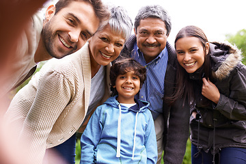 Image showing Selfie, love and portrait of a big family on an outdoor adventure, travel or journey together. Happy, smile and boy child taking picture with his grandparents and parents while on holiday or vacation