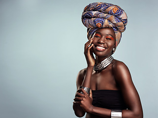 Image showing Smile, black woman and portrait with African head wrap and beauty in a studio. Isolated, grey background traditional Africa turban with a young face and female model with culture pride and mockup