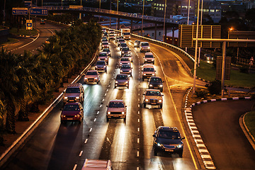 Image showing Traffic jam, highway and street in night for driving, transportation or travel in rush hour. Busy urban road, cars and journey in Cape Town metro with congestion, infrastructure network and cityscape