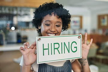 Image showing Happy woman, hiring sign and window at cafe in small business for growth, advertising or billboard. African female person at restaurant holding board for hire message or recruiting at coffee shop