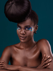 Image showing Portrait or head and shoulders makeup with a black woman in studio on a blue background for hair or cosmetics. Face, haircare and fashion with an attractive young female model at the salon for style