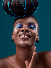 Image showing Happy, hair and cosmetics with a model black woman in studio on a blue background for beauty. smile, haircare and makeup with an attractive young female person at the salon for fashion or styling