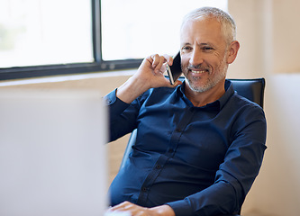 Image showing Business, senior businessman on phone call and computer at desk in office. Corporate, social networking or communication with smartphone and mature man on cellphone talking on phone with pc at work