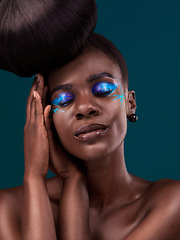 Image showing Face, beauty and cosmetics with an african woman in studio on a blue background for hair or cosmetics. Eyes closed, haircare and fashion with an attractive young female model at the salon for style