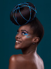 Image showing Thinking, happy and hair with a model black woman in studio on a blue background for beauty. Idea, smile and makeup with an attractive young female person at the salon for trendy fashion or cosmetics