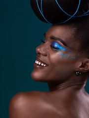 Image showing Happy, hair and makeup with a model black woman in studio on a blue background for beauty. Smile, haircare and cosmetics with an attractive young female person at the salon for fashion or styling