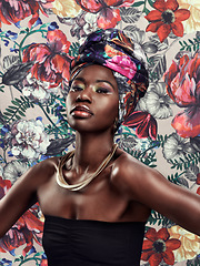 Image showing Black woman in portrait in turban, fashion on flower background and beauty, makeup and floral aesthetic. Natural cosmetics, female model in traditional African head wrap with creativity and style