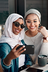 Image showing Coffee shop, couple of friends and selfie for social media, customer experience or influencer content creation. Gen z people or young islamic women, profile picture photography and cafe or restaurant