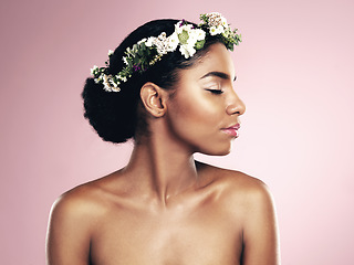 Image showing Woman, flowers and hair crown for beauty in studio, pink background and natural skincare glow. African face, female model and floral headband of plants, sustainable cosmetics and eco friendly makeup