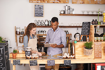 Image showing Small business owners, tablet and teamwork of people, manage orders and discussion in store. Waiters, black man and happy woman in cafe with technology for inventory, stock check and managing sales.