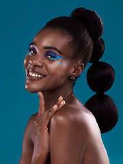 Image showing Portrait, smile and makeup with a model black woman in studio on a blue background for hair or cosmetics. Face, happy and fashion with an attractive young female person posing to promote beauty