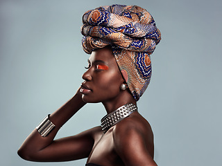 Image showing Black woman in African turban, fashion and beauty with makeup isolated on studio background. Natural cosmetics, face profile and female model with traditional head wrap, mockup space and style