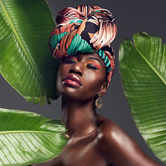 Image showing Leaf, makeup and portrait of black woman in studio for glow or natural cosmetics on grey background. Culture, beauty and face of African lady model with plant for cosmetology and jungle aesthetic