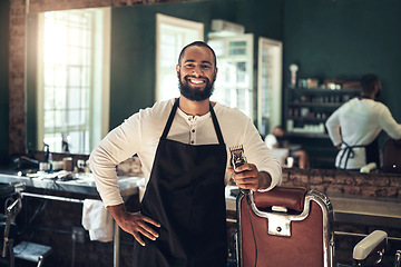 Image showing Barber shop, hair clipper and black man portrait of an entrepreneur with a smile. Salon, professional worker and male person face with happiness and proud from small business and beauty parlor