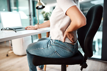 Image showing Back pain, stress and business woman at desk with burnout, muscle ache and tension in sitting posture. Health, medical emergency and female worker with spine problem, accident and injury in office