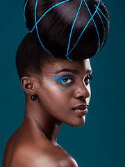 Image showing Portrait, hair and makeup with a serious black woman in studio on a blue background for beauty. Face, haircare and cosmetics with an attractive young female model at the salon for fashion or styling