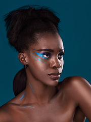 Image showing Thinking, natural hair and makeup with a black woman in studio on a blue background for beauty. Idea, haircare and cosmetics with an attractive young female model at the salon for fashion or styling