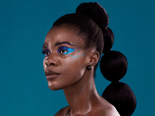 Image showing Idea, makeup and cosmetic with a model black woman in studio on a blue background for hair or beauty. Face, thinking and fashion with an attractive young female person posing to promote cosmetics