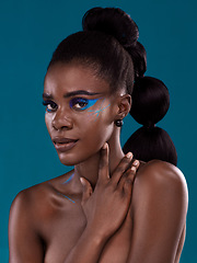 Image showing Portrait, makeup and hair care with an african woman in studio on a blue background for hairstyle or cosmetics. Face, haircare and fashion with an attractive young female model posing for beauty