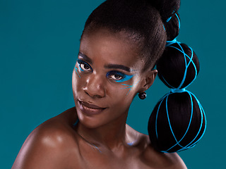 Image showing Portrait, beauty and makeup with an african woman in studio on a blue background for hair or cosmetics. Face, haircare and fashion with an attractive young female model at the salon for style