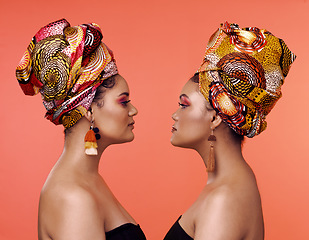 Image showing African fashion, friends and profile of women on orange background with cosmetics, makeup and accessories. Glamour, beauty and face of female people with exotic jewelry, luxury style and head scarf