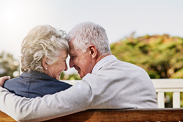 Image showing Senior couple, bonding and hug or relaxing together outdoors or romantic retirement and park bench. Elderly, partners and affectionate or in love or date and feeling care for pension or garden