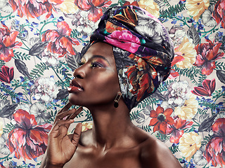 Image showing Black woman in African turban, fashion on flower background and beauty, makeup with floral aesthetic. Natural cosmetics, profile and female model in traditional head wrap with creativity and style