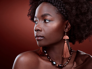 Image showing Natural, beauty and black woman in studio with glowing skin on gradient, maroon or red background. Face, body care and African lady model with culture, pride and cosmetic or isolated art aesthetic