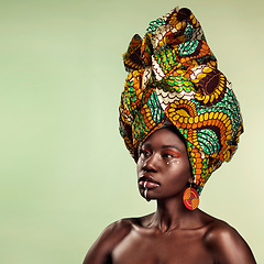 Image showing Beauty, black woman and cosmetics with African turban and makeup with mockup. Isolated, green background and young female person thinking with a traditional hair scarf with confidence and culture