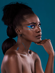 Image showing Portrait, natural hair and cosmetics with a black woman in studio on a blue background for beauty. Face, haircare and makeup with an attractive young female model at the salon for fashion or styling