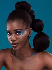 Image showing Portrait, makeup and bold with a model black woman in studio on a blue background for hair or cosmetics. Face, confidence and fashion with an attractive young female person posing to promote beauty