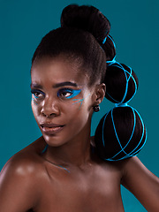 Image showing Idea, beauty and cosmetics with a model african woman in studio on a blue background for hair or fashion. Face, makeup and idea with an attractive young female person posing for trendy haircare