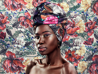 Image showing Portrait, flowers and black woman with head wrap, beauty and confident girl against a floral background. Face, female person or model with fashion, glamour and elegant with stylish turban and culture