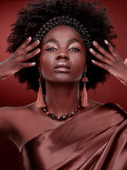 Image showing Portrait, beauty and black woman with fashion in studio isolated on a red background. Face, makeup cosmetics and confident African model with stylish outfit, traditional headband or culture aesthetic