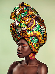 Image showing Beauty, black woman and fashion cosmetics with African head wrap and makeup with mockup. Isolated, green background and young female person with a traditional hair scarf with confidence feeling relax