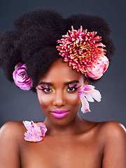 Image showing Art, flowers and portrait of black woman in studio for beauty, creative and spring. Natural, cosmetics and floral with african model isolated on dark background for makeup, self love or confidence