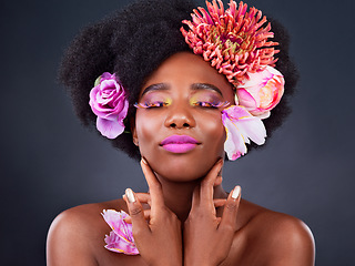 Image showing Makeup, flowers and beauty with black woman in studio for color, creative and spring. Natural, cosmetics and floral with african model isolated on background for art, self love or confidence