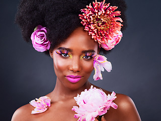 Image showing Beauty, flowers and portrait of black woman in studio for makeup, creative and spring. Natural, cosmetics and floral with face of model isolated on background for art, self love or confidence