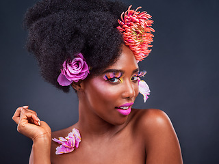 Image showing Makeup, flowers and black woman portrait in studio for organic beauty on black background. Floral, face and African female model pose with eco friendly, natural and cosmetics with isolated mockup