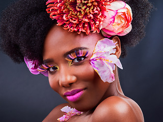 Image showing Makeup, flowers and spring with portrait of black woman for beauty, creative and art. Natural, cosmetics and floral with face of model isolated on studio background for color, self love or confidence