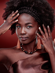 Image showing Portrait, beauty and black woman with fashion in studio isolated on a red background. Natural face, makeup cosmetics and confident African model with stylish outfit, traditional headband or aesthetic